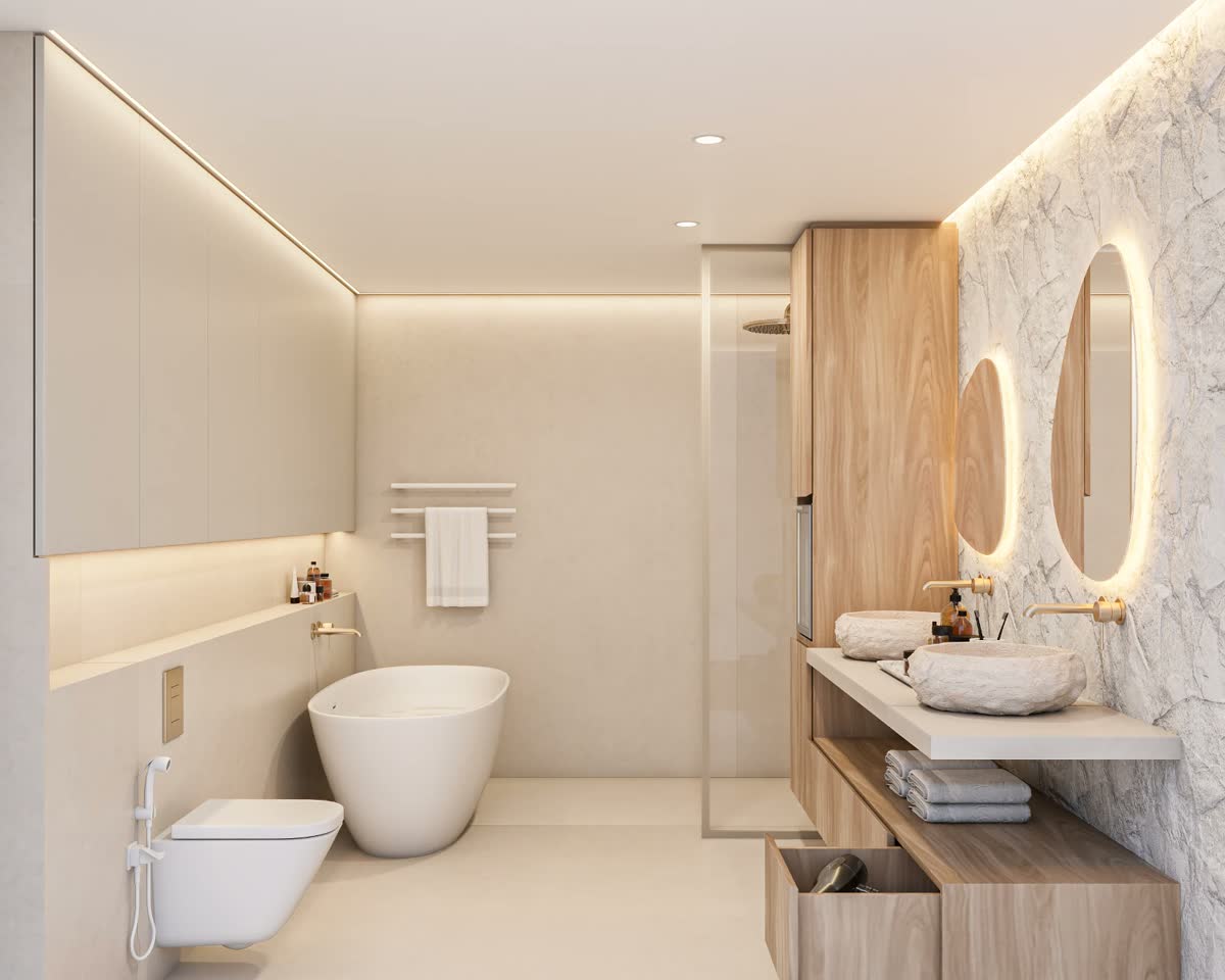 Bathroom with freestanding bath, stone wall and oak joinery by Liv'in