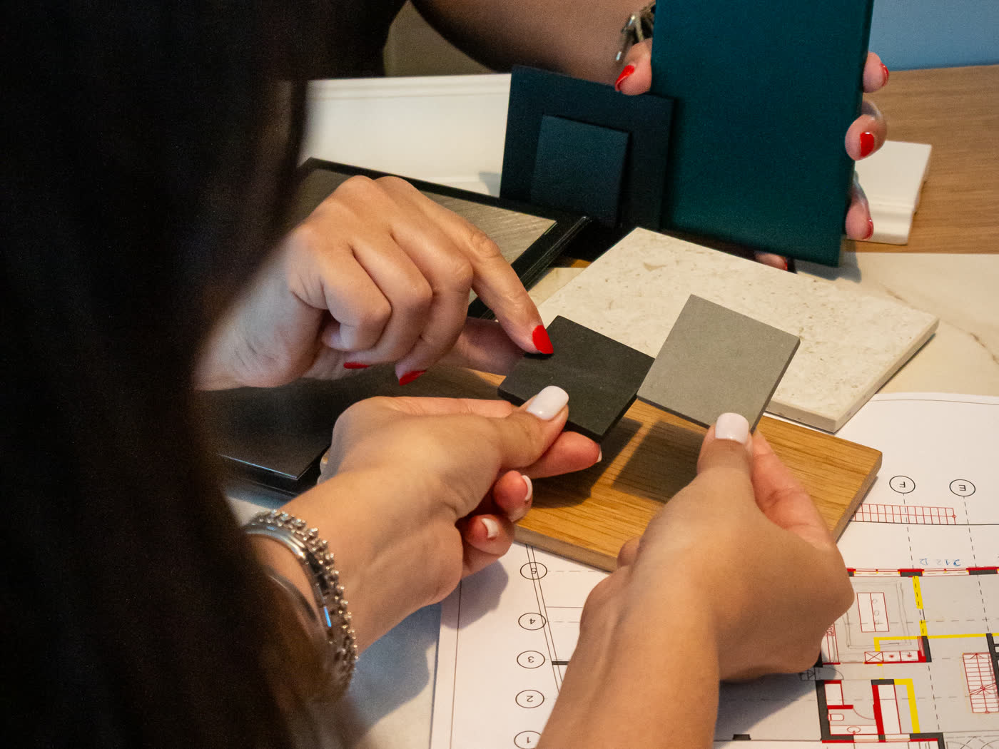 Material samples chosen over the house plans at the Liv'in atelier